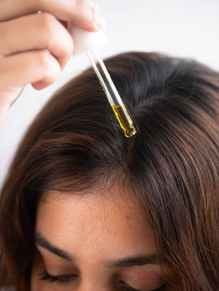 Dropper on Head with Hair Oil